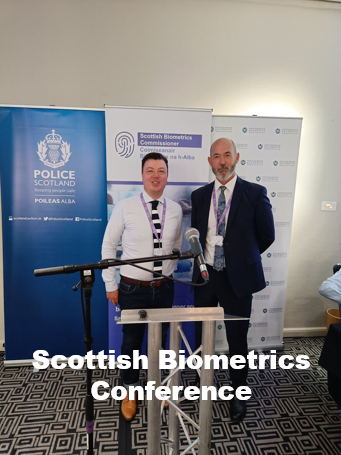 The Commissioner and Operations Manager in front of SBC Banner. 